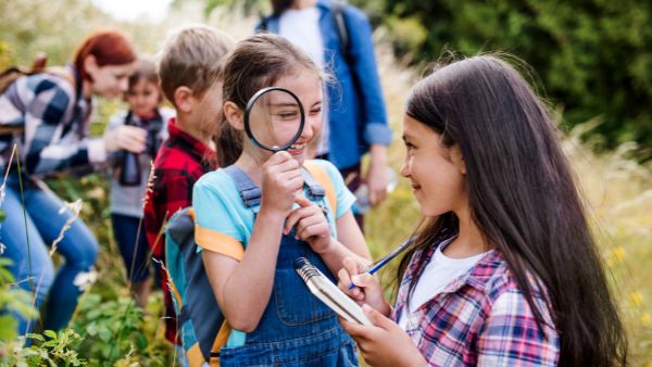 school kids smile for a picture while on a field trip