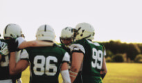 a football team in a huddle