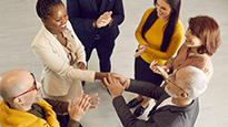 Business people shake hands in a lobby