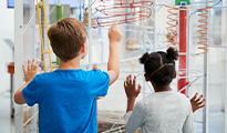 two students on a field trip to a science museum