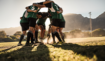 football players in a huddle